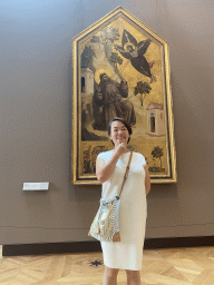 Miaomiao with a painting at the First Floor of the Denon Wing of the Louvre Museum