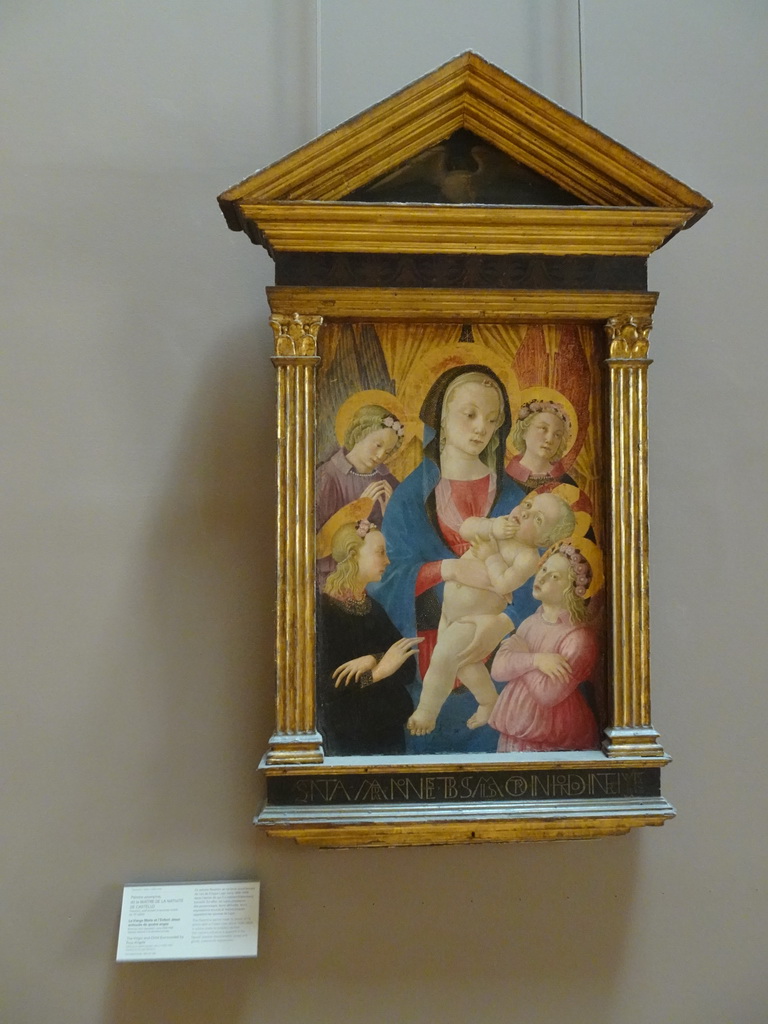 Painting `Virgin and Child surrounded by four angels` at the First Floor of the Denon Wing of the Louvre Museum