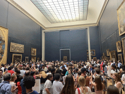 Painting `Mona Lisa` by Leonardo da Vinci and other paintings at the First Floor of the Denon Wing of the Louvre Museum