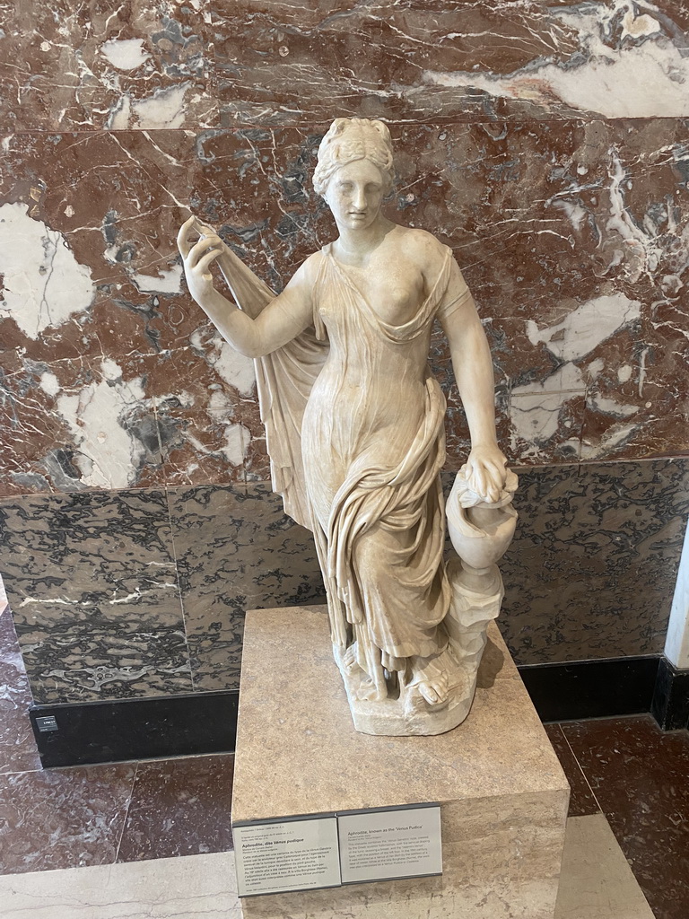 Statue `Aphrodite` or `Venus Pudica` at the Parthenon Room at the Ground Floor of the Sully Wing of the Louvre Museum, with explanation