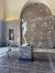 Statue `Venus de Milo` and another sculpture at the Parthenon Room at the Ground Floor of the Sully Wing of the Louvre Museum