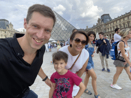 Tim, Miaomiao and Max in front of the Louvre Pyramid and the Sully Wing of the Louvre Museum at the Cour Napoléon courtyard