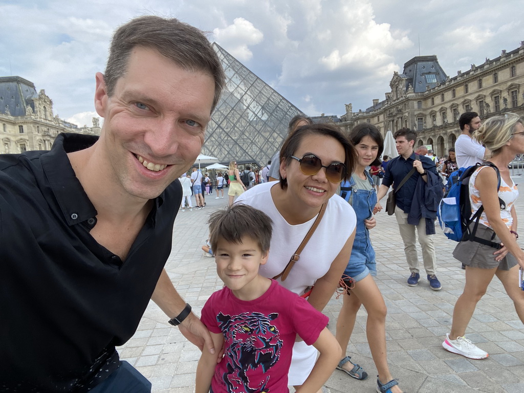 Tim, Miaomiao and Max in front of the Louvre Pyramid and the Sully Wing of the Louvre Museum at the Cour Napoléon courtyard