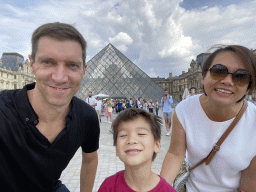 Tim, Miaomiao and Max in front of the Louvre Pyramid and the Sully Wing of the Louvre Museum at the Cour Napoléon courtyard