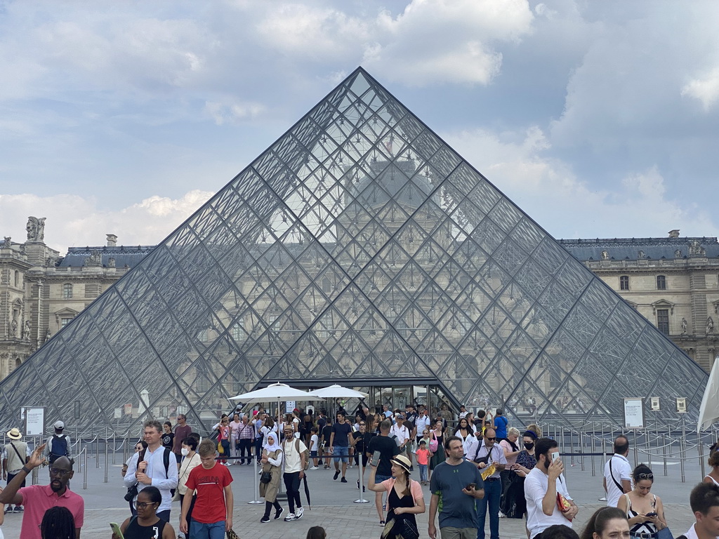 The Louvre Pyramid and the front of the Sully Wing of the Louvre Museum at the Cour Napoléon courtyard