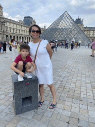 Miaomiao and Max in front of the Louvre Pyramid and the Sully Wing of the Louvre Museum at the Cour Napoléon courtyard
