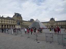 Equestrian statue of King Louis XIV and the Louvre Pyramid in front of the Richelieu and Sully Wings of the Louvre Museum at the Cour Napoléon courtyard