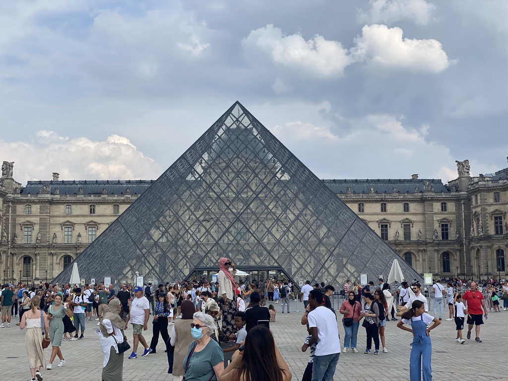 The Louvre Pyramid and the front of the Sully Wing of the Louvre Museum at the Cour Napoléon courtyard