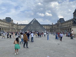 The Louvre Pyramid and the front of the Louvre Museum at the Cour Napoléon courtyard