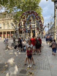 Miaomiao and Max in front of the entrance to the Palais Royal - Musée du Louvre subway station at the Place Colette square