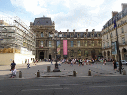 The Place du Palais Royal square and the gate at the north side of the Richelieu Wing of the Louvre Museum, viewed from the Rue Saint-Honoré street
