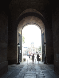 The gate at the south side of the Sully Wing of the Louvre Museum from the Cour Carrée courtyard to the Voie Georges Pompidou street, with a view on the Pont des Arts bridge and the Institut de France building