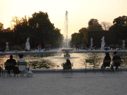 Fountain at the Grand Bassin Rond pond at the Tuileries Gardens, the Luxor Obelisk and the Arc de Triomphe