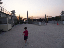 Max walking from the Tuileries Gardens to the Place de la Concorde square with the Luxor Obelisk