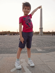 Max in front of the Luxor Obelisk at the Place de la Concorde square, at sunset
