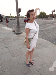 Miaomiao at the Place de la Concorde square with a view on the Eiffel Tower, at sunset