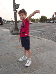 Max at the Place de la Concorde square with a view on the Eiffel Tower, at sunset