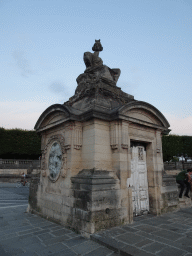 Small building with statue on top at the Place de la Concorde square, at sunset