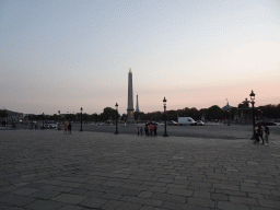 The Place de la Concorde square with the Luxor Obelisk and a view on the Eiffel Tower, at sunset