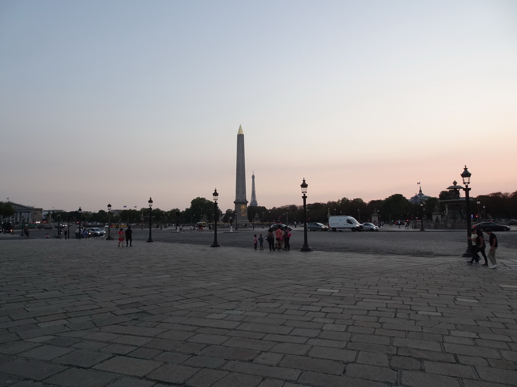 The Place de la Concorde square with the Luxor Obelisk and a view on the Eiffel Tower, at sunset