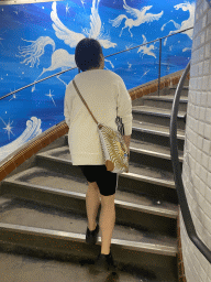 Miaomiao at the staircase at the Abbesses subway station
