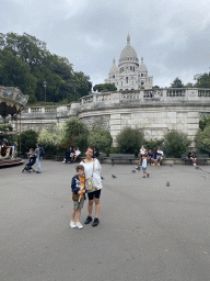 Miaomiao and Max at the Place Saint-Pierre square, with a view on the Square Louise Michel and the front of the Basilique du Sacré-Coeur church