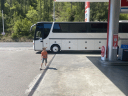 Max in front of the tour bus at the LUKOIL Sutorina gas station at the town of Sutorina