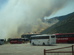 Smoke from a forest fire near the town of Njivice, viewed from the tour bus on the E65 road at the town of Sutorina