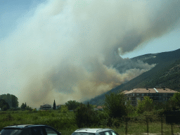 Smoke from a forest fire near the town of Njivice, viewed from the tour bus on the E65 road at the town of Sutorina