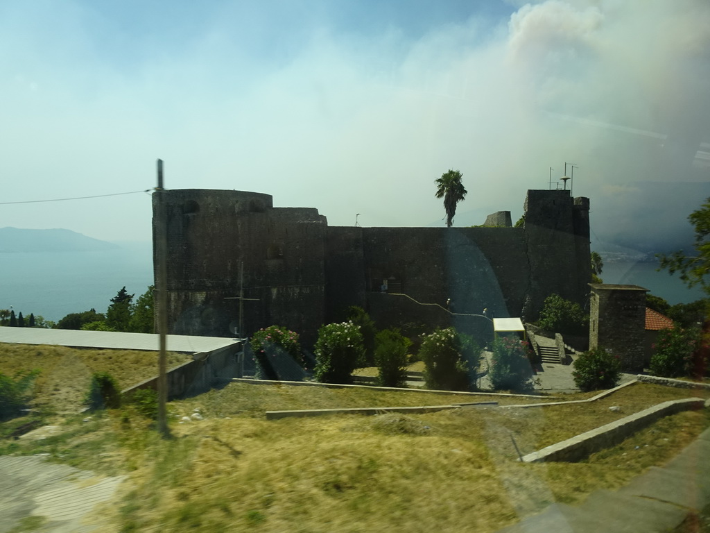 The Kanli Kula fortress at the town of Herceg Novi, viewed from the tour bus on the E65 road