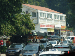 Front of the Coning hardware store at the town of Meljine, viewed from the tour bus on the E65 road