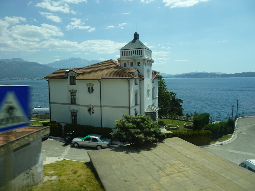 Building at the town of Bijela and the Bay of Kotor, viewed from the tour bus on the E65 road