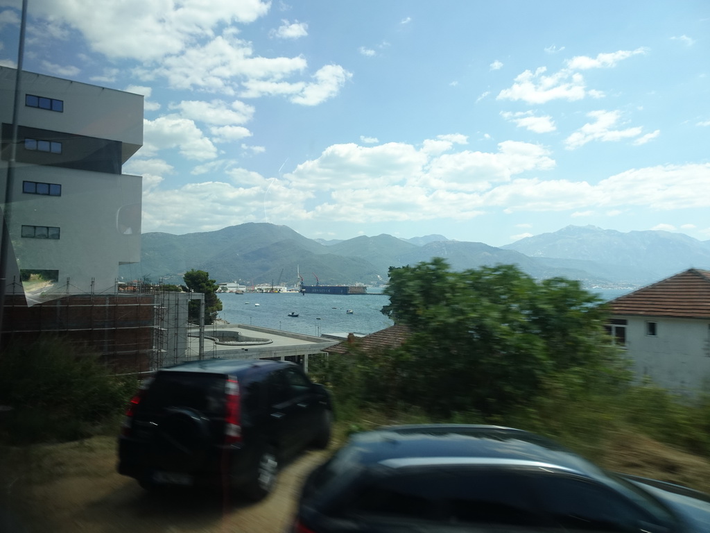 Buildings and harbour at the town of Bijela and the Bay of Kotor, viewed from the tour bus on the E65 road