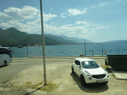 Beach at the town of Joice and the Bay of Kotor, viewed from the tour bus on the E65 road