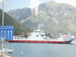 The Kamenari Lepetani ferry at the Kamenari Harbour, the Bay of Kotor and the town of Perast, viewed from the tour bus on the E65 road
