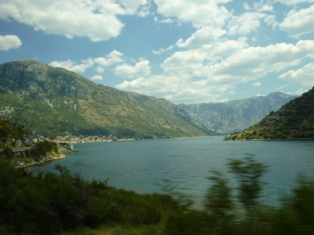 The Bay of Kotor and the town of Perast, viewed from the tour bus on the E65 road just north of the town of Kamenari