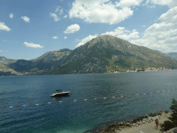 The Bay of Kotor with the Our Lady of the Rocks Island and the Saint George Island and the town of Perast, viewed from the tour bus on the E65 road at the town of Kostanjica