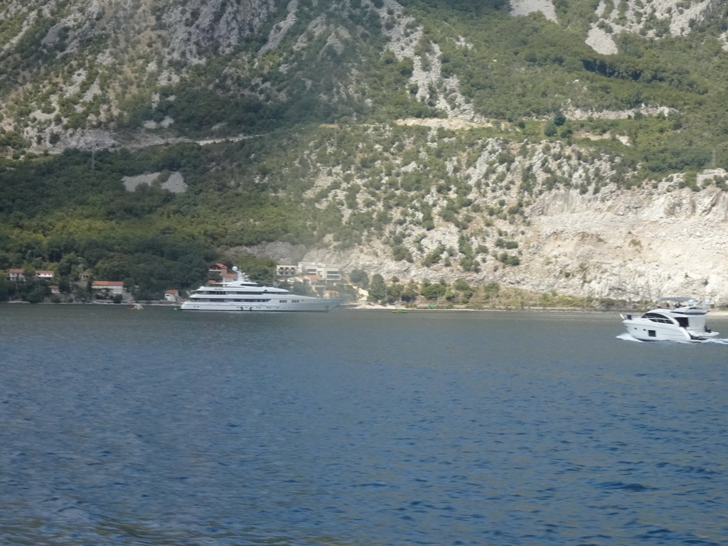 Boats at the Bay of Kotor and the town of Morinj, viewed from the tour bus on the E65 road at the town of Kostanjica