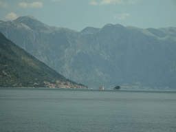 The Bay of Kotor with the Our Lady of the Rocks Island and the Saint George Island and the town of Perast, viewed from the tour bus on the E65 road at the town of Morinj