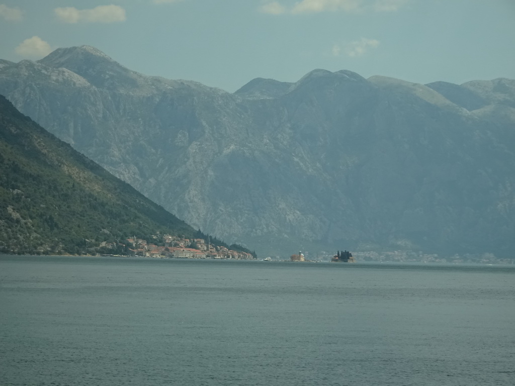 The Bay of Kotor with the Our Lady of the Rocks Island and the Saint George Island and the town of Perast, viewed from the tour bus on the E65 road at the town of Morinj