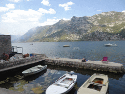 Boats at the Risan Harbour and the Bay of Kotor, viewed from the tour bus on the E65 road
