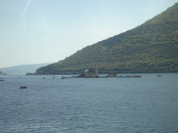 The Bay of Kotor with the Our Lady of the Rocks Island, viewed from the tour bus on the E65 road just northwest of the town of Perast