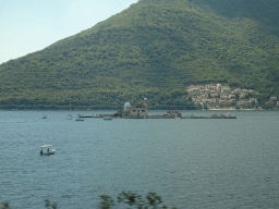 The Bay of Kotor with the Our Lady of the Rocks Island and the town of Kostanjica, viewed from the tour bus on the E65 road just northwest of the town of Perast