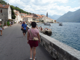 Miaomiao at the promenade, the Church of Saint Nicholas and boats of the Bay of Kotor