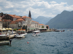 The Church of Saint Nicholas and boats at the Bay of Kotor, viewed from the promenade