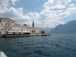 Boats in front of the town center with the Church of Saint Nicholas, viewed from the ferry from the town center to the Our Lady of the Rocks Island