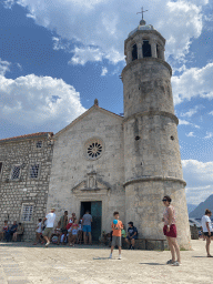 Miaomiao and Max with a balloon at the northwest side and tower of the Church of Our Lady of the Rocks at the Our Lady of the Rocks Island