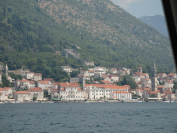 The town center with the Church of Saint Nicholas, the Tvrdava sv. Kria fortress and the Crkva Gospe od Ruarija church, viewed from the ferry from the Our Lady of the Rocks Island to the town center