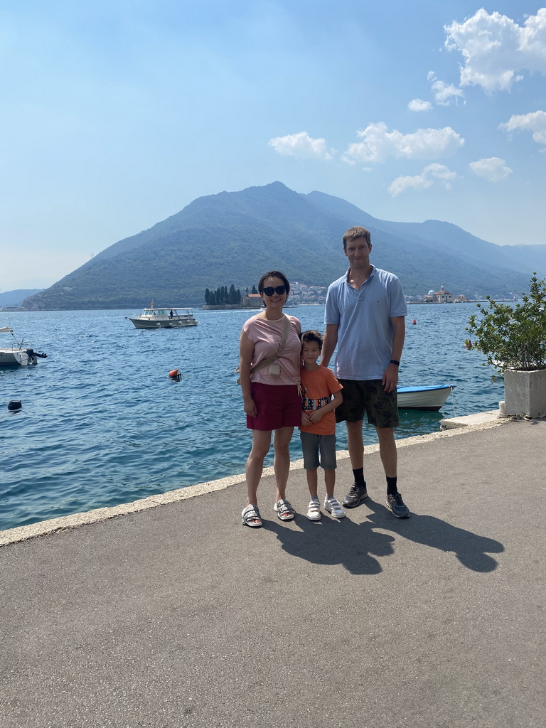 Tim, Miaomiao and Max at the promenade, with a view on the Bay of Kotor with the Our Lady of the Rocks Island and the Saint George Island