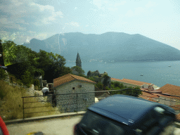 The Bay of Kotor and the Crkva Gospe od Ruarija church, viewed from the tour bus on the E65 road